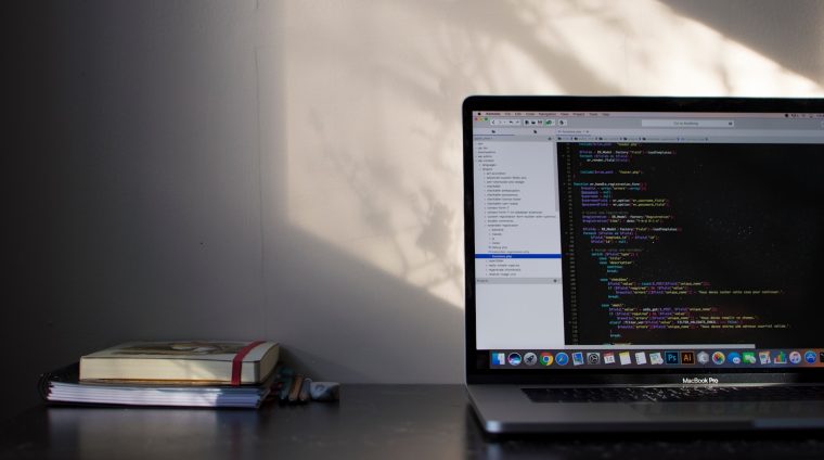 Photo by Emile Perron MacBook Pro showing programming language